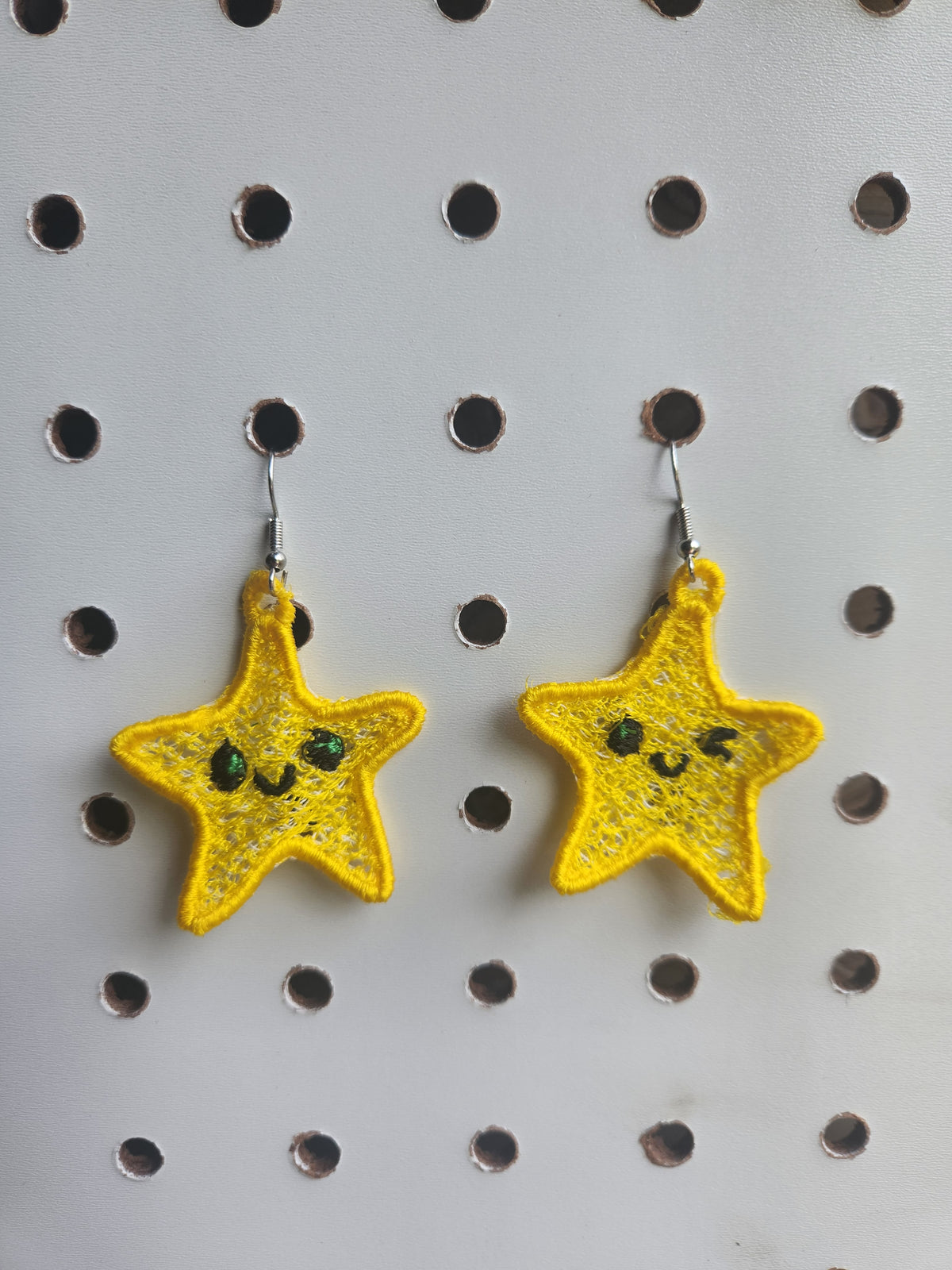 Winking star embroidered earrings