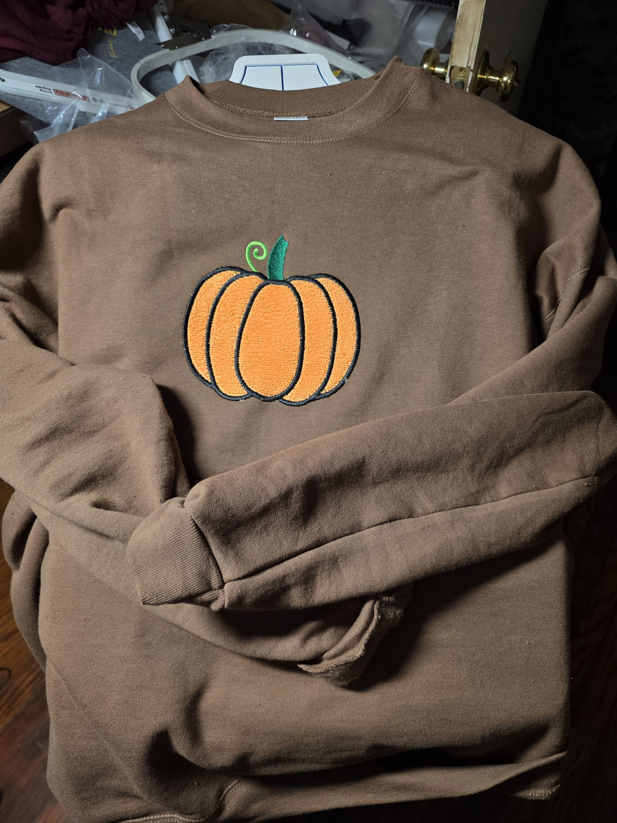 Chocolate Brown crewneck with fuzzy textured embroidered orange pumpkin