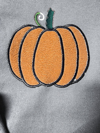 Close-up of fuzzy embroidered pumpkin on Gray (mockup)